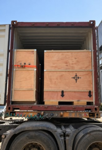 Wooden cases loaded into a shipping container
